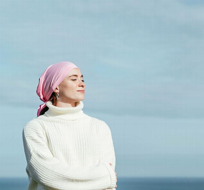 lady with head scarf on beach